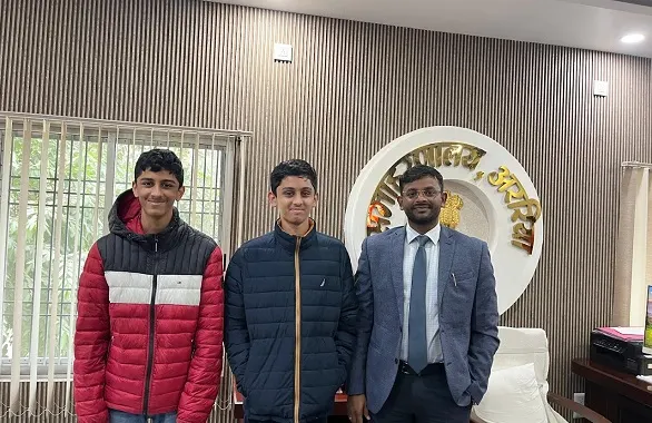 Rohan and Rishabh with District Magistrate to have a building
                  and two more teachers at Primary School Nai Tola, Fulbari.