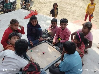 Students playing Carom at Middle School Fulbari. Games were
                provided to generate interest.